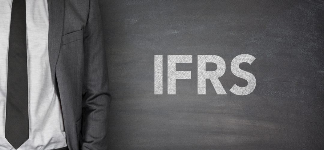 International financial reporting standards on black blackboard